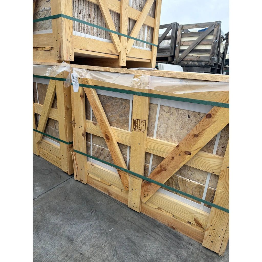 Scabos Autumn Leaves Travertine Versailles set in light wooden crate with green straps