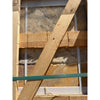 Light brown wooden beam with visible grain and small hole resting diagonally in scabos autumn leaves travertine versailles set