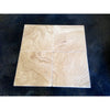 Four Scala Nova Walnut Wavy travertine tiles in 18x18 grid, brushed chiseled