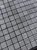 Seagrass Limestone 1x1 tumbled mosaic with gray stone veining