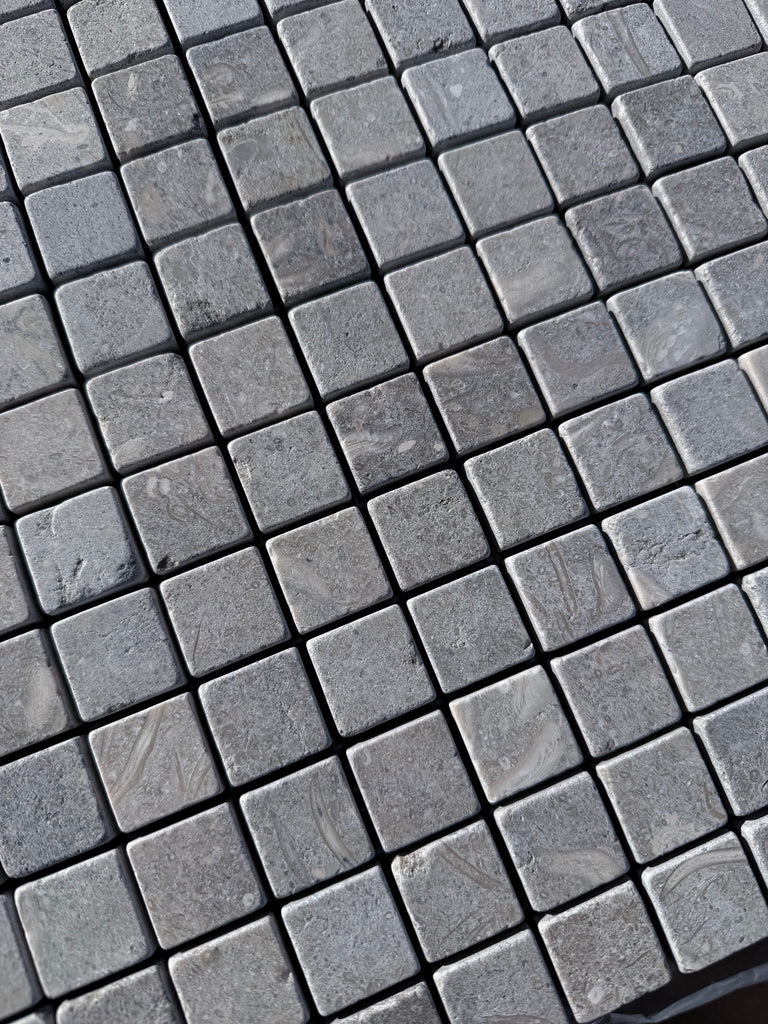 Seagrass Limestone 1x1 tumbled mosaic with gray stone veining