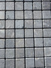 Seagrass Limestone 1x1 tumbled mosaic with gray stone veining and textured surface
