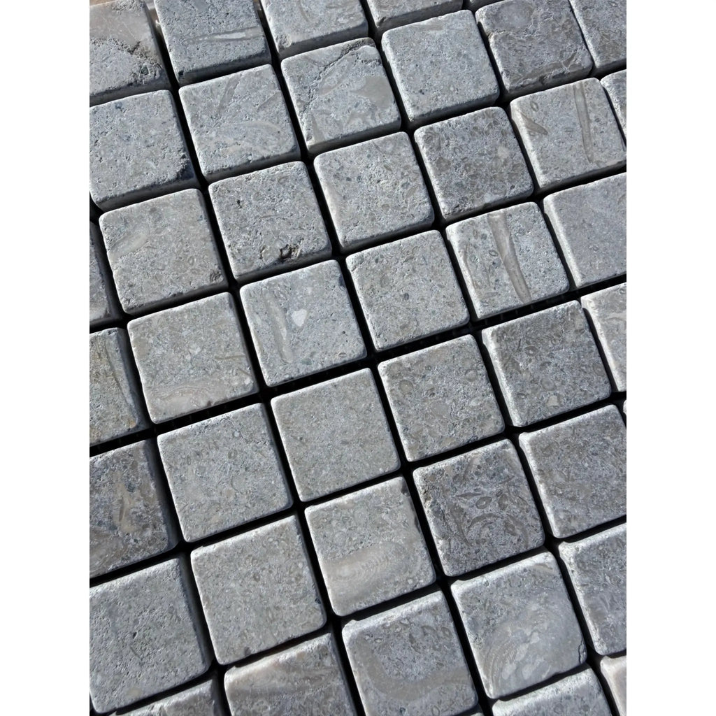 Seagrass Limestone 1x1 Mosaic Tumbled gray stone pavers with textured natural surface