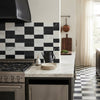 Black and white marble checkered backsplash tiles in siena set featuring bianco dolomite 4x12 and nero marquina 6x12