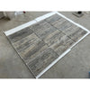 Silver gray travertine 12x24 vein-cut tile with gray stone-effect and natural wood grain texture on white backing