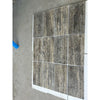 Silver gray travertine 12x24 vein cut tile with natural textured stone effect and filled honed polished finish in grid pattern