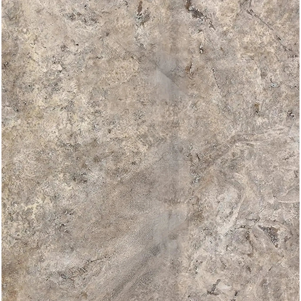Textured beige stone surface of Silver Gray Travertine 18X18 Tile Filled and Honed