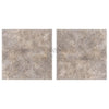 Two square speckled gray tiles from Silver Travertine 18X18 Tile collection