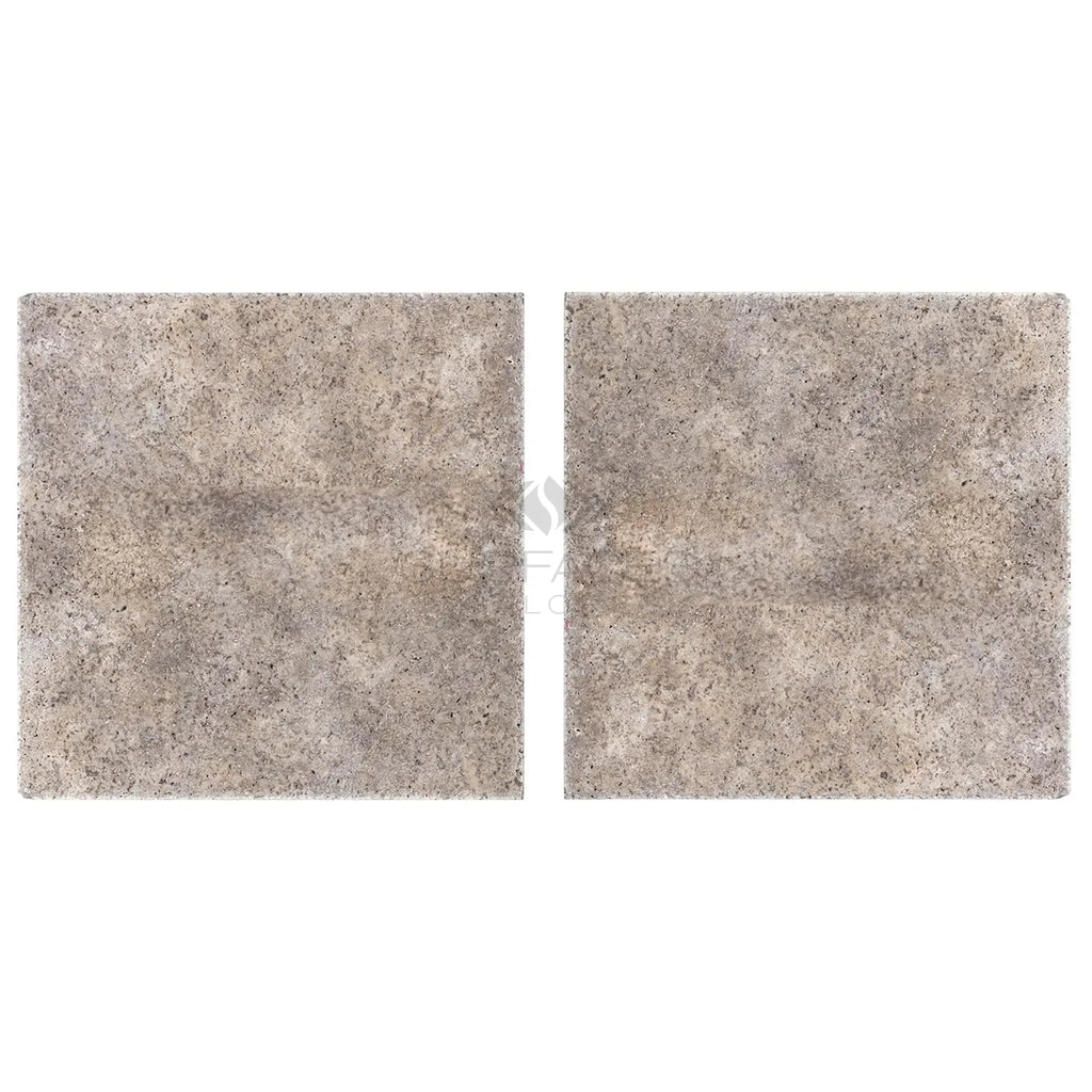 Two square speckled gray tiles from Silver Travertine 18X18 Tile collection