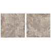 Two square, mottled beige tiles of Silver Travertine 24X24, filled and honed