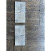 Cream-colored rectangular travertine tiles with rustic texture for Silver Gray 3x6 Tumbled product