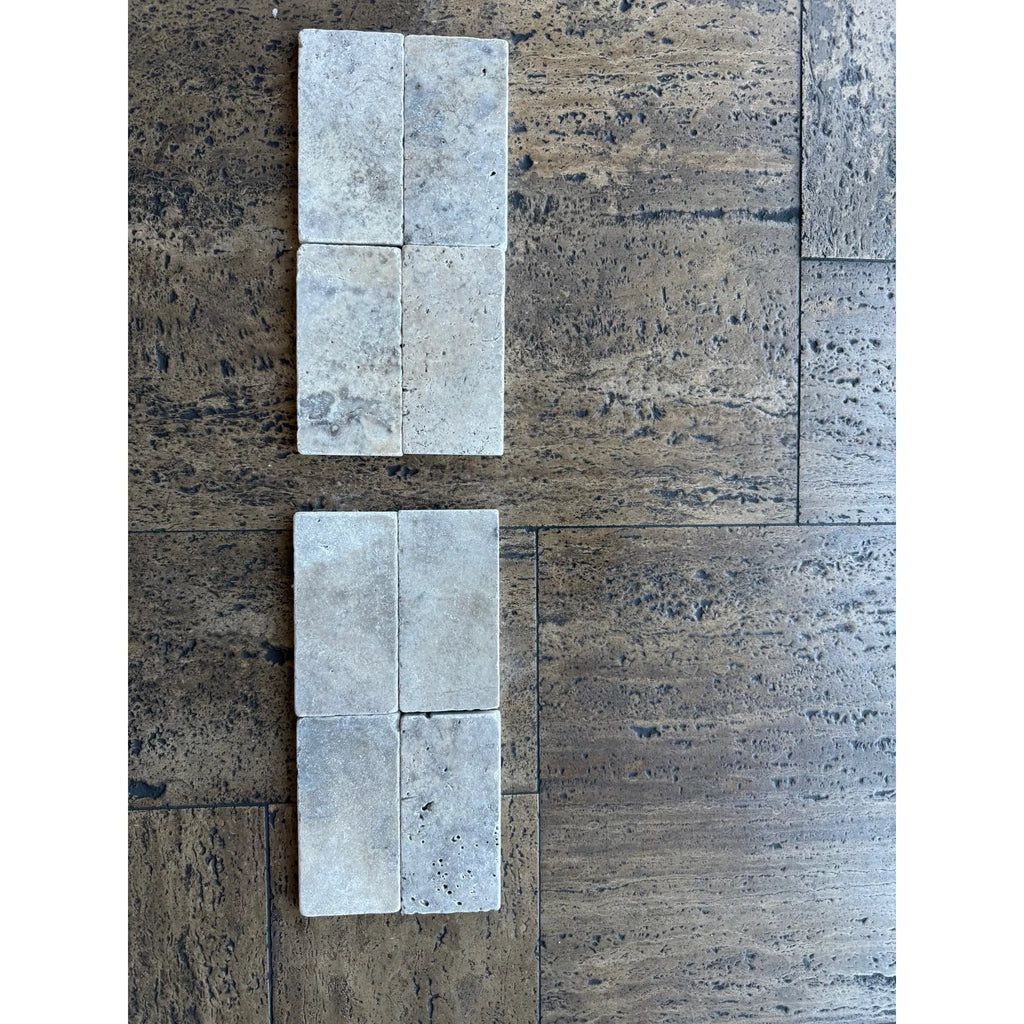 Cream-colored rectangular travertine tiles with rustic texture for Silver Gray 3x6 Tumbled product