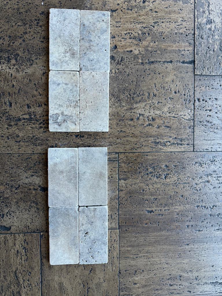 Cream-colored rectangular travertine tiles with rustic texture for Silver Gray 3x6 Tumbled product