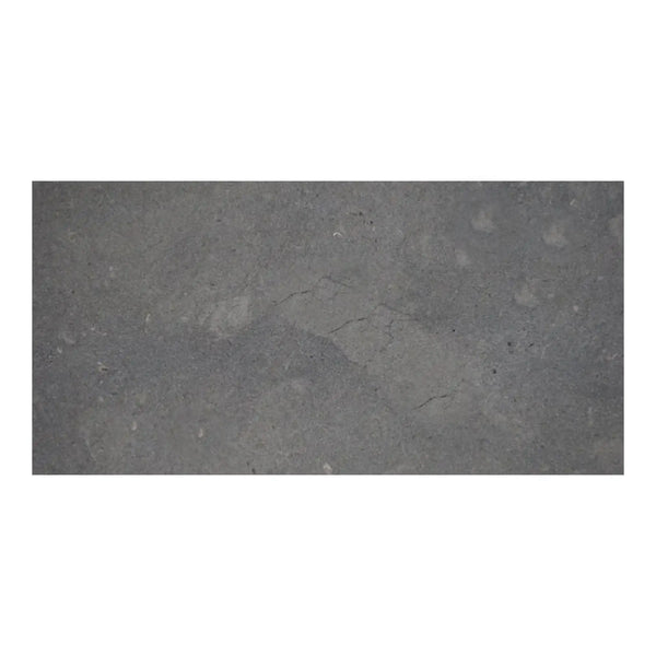 Silvermoor 12x24 honed limestone slab with gray concrete texture and faint cracks