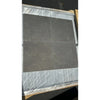 Silvermoor 18x18 honed limestone tiles in dark gray marbled stone, plastic-wrapped on wood