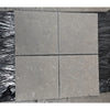 Silvermoor 24x24 honed limestone: four gray stone pavers with speckled texture