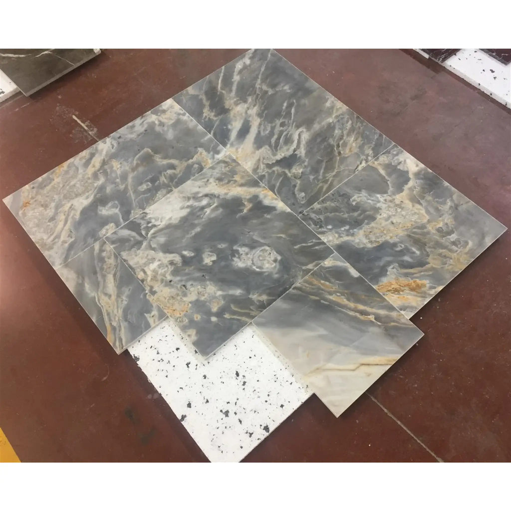 Assorted square marble tiles featured in Sky Blue Azul Cielo 12X24 Marble Tile