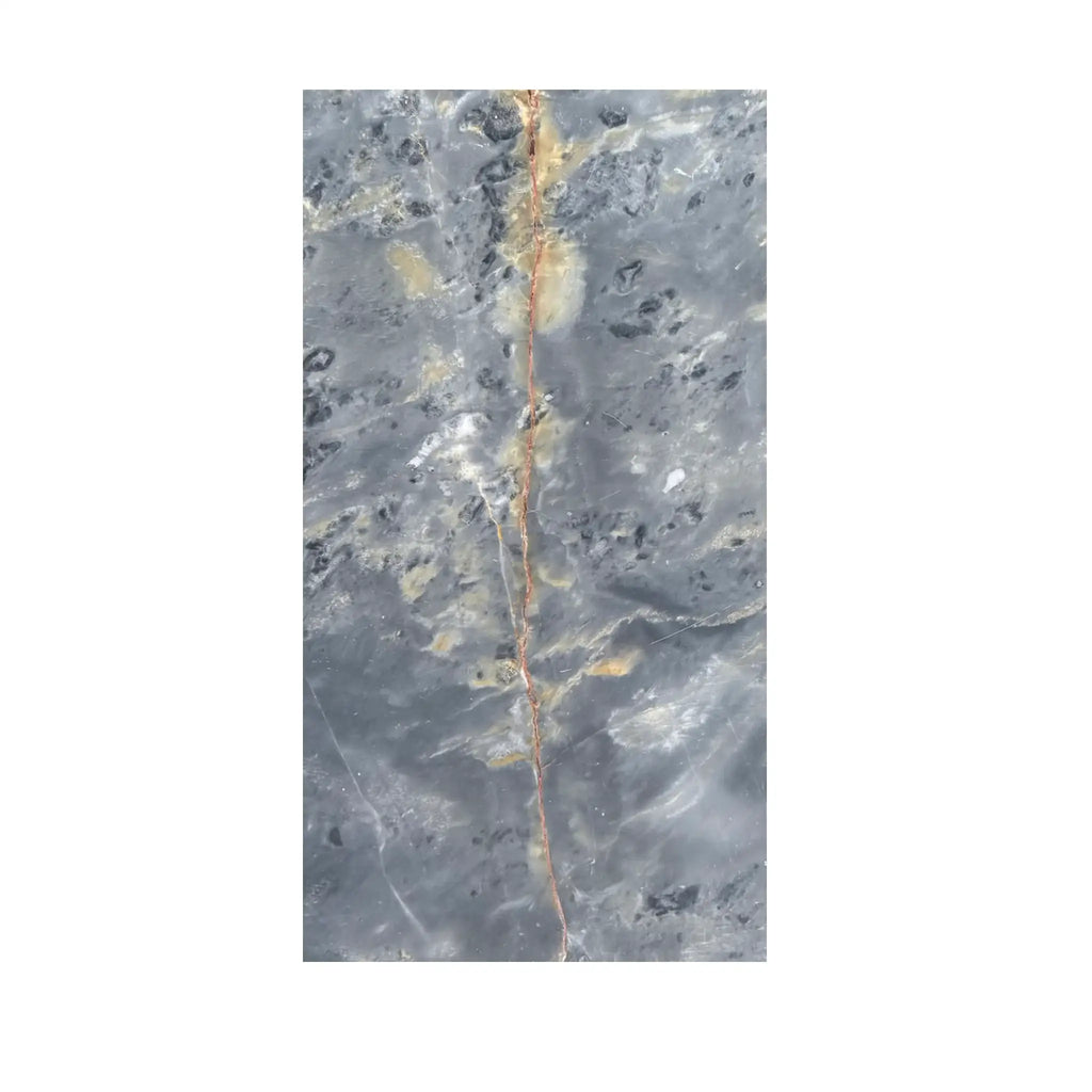 Gray marble slab with golden vein featured in Sky Blue Azul Cielo 12X24 Marble Tile