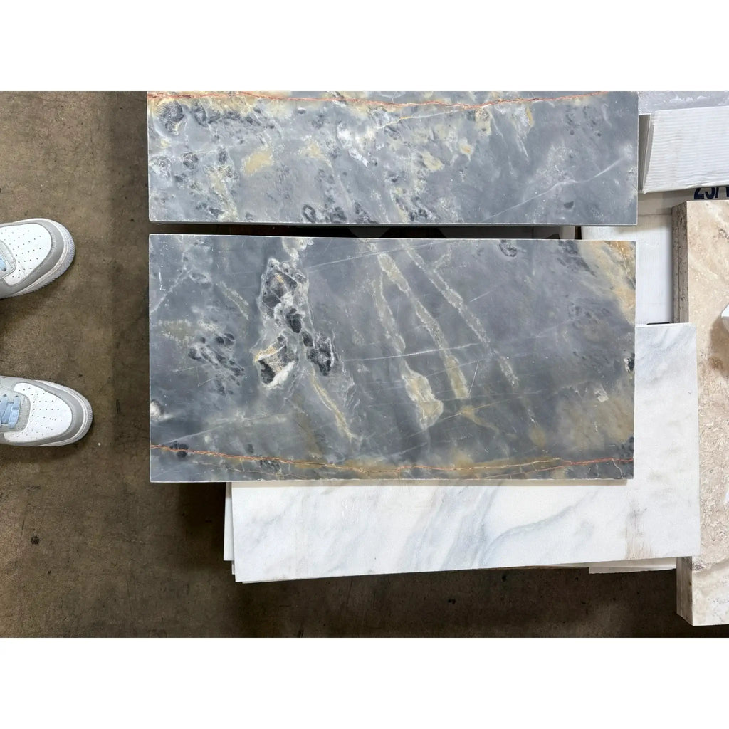 Gray marble tiles with unique veining from Sky Blue Azul Cielo 12X24 Marble Tile