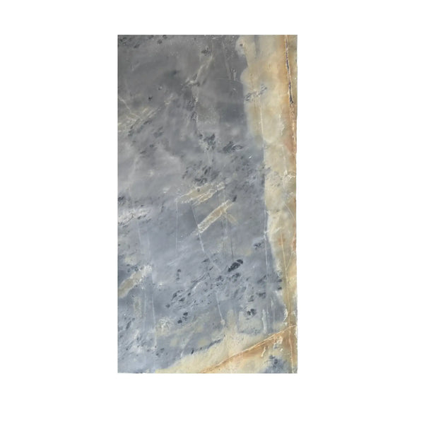 Grey and beige marble slab featured in Sky Blue Azul Cielo 12X24 Marble Tile