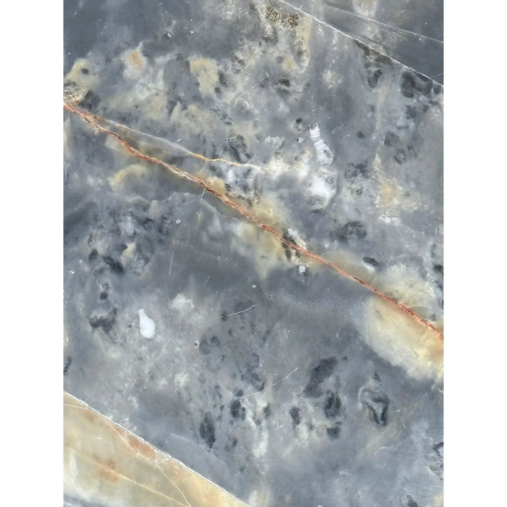 Polished gray and white marble slab with reddish-brown vein in Sky Blue Azul Cielo tile