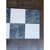 Checkerboard pattern of white and gray marble tiles from Sky Blue Azul Cielo collection