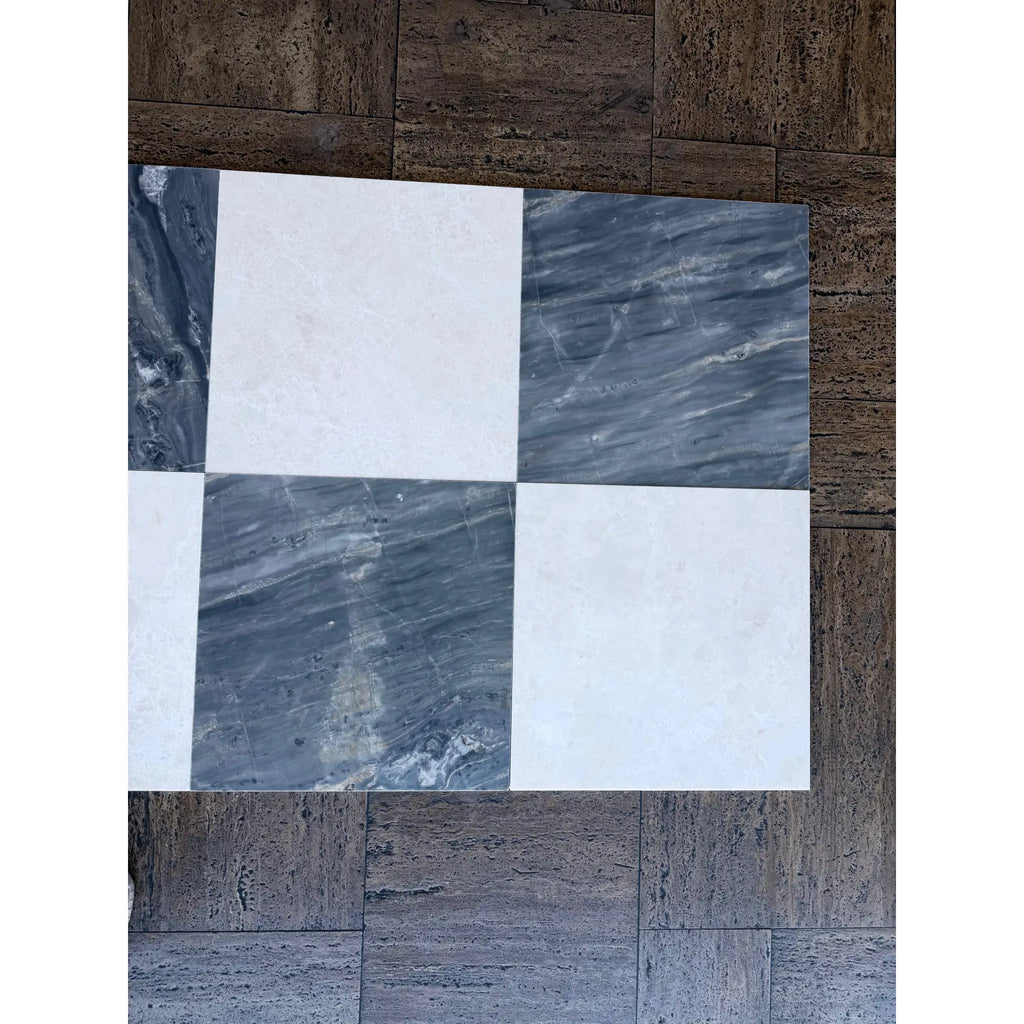 Checkerboard pattern of white and gray marble tiles from Sky Blue Azul Cielo collection
