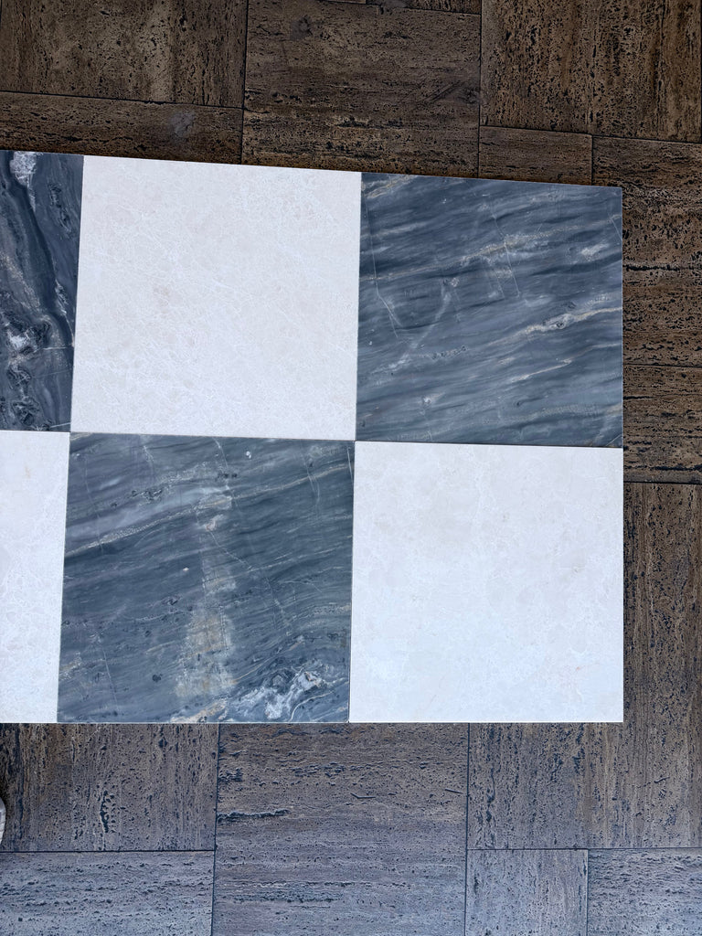 Checkerboard pattern of white and gray marble tiles from Sky Blue Azul Cielo collection