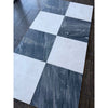 Checkerboard pattern of white and dark gray marble tiles from Sky Blue Azul Cielo 18X18 collection