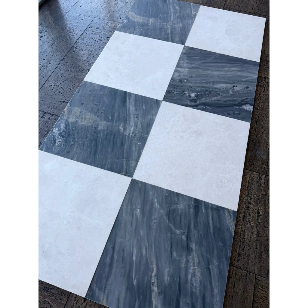 Checkerboard pattern of white and dark gray marble tiles from Sky Blue Azul Cielo 18X18 collection