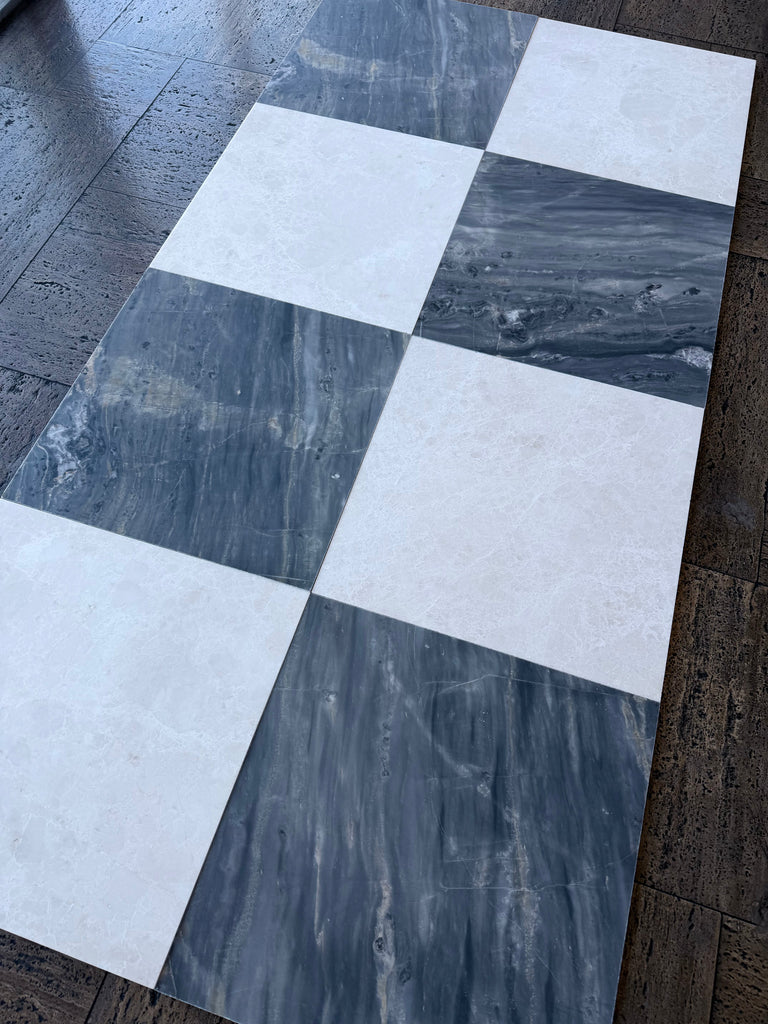 Checkerboard pattern of white and dark gray marble tiles from Sky Blue Azul Cielo 18X18 collection
