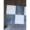 Checkerboard pattern of white and gray marble tiles from Sky Blue Azul Cielo collection
