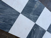 Checkered white and gray marble floor tiles from Sky Blue Azul Cielo 18X18 collection