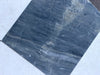 Dark blue-grey marble tile with white and light grey veining from Sky Blue Azul Cielo collection