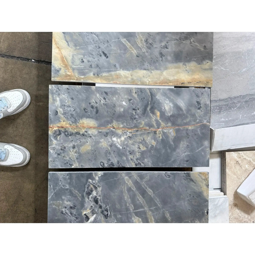 Gray marble tiles with elegant veining in Sky Blue Azul Cielo 18X18 Marble Tile