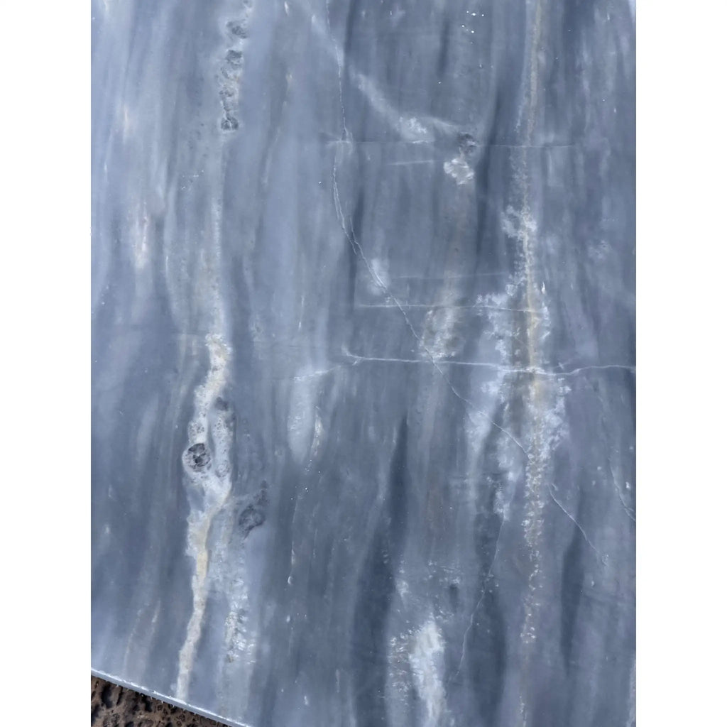 Polished grey and white streaked Sky Blue Azul Cielo 18x18 marble tile with natural veining