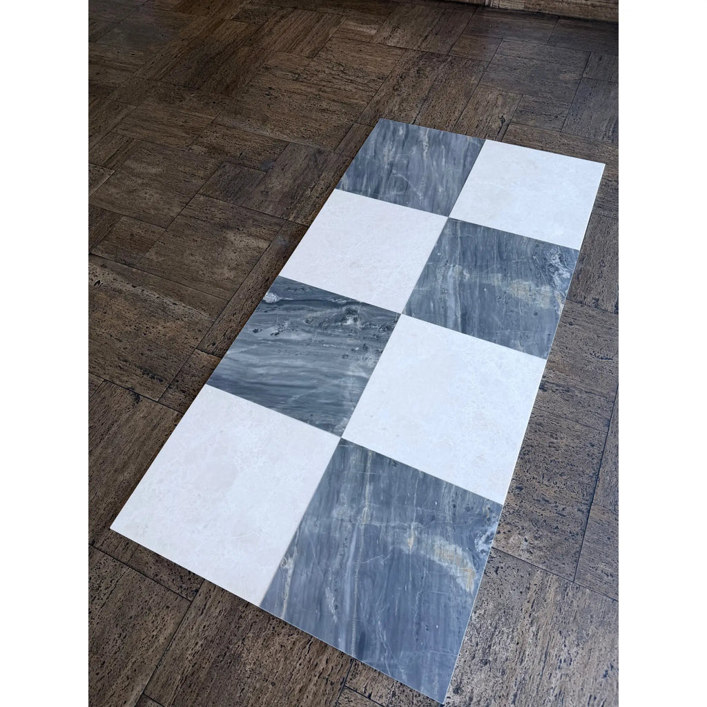 Sample of Sky Blue Azul Cielo 18X18 marble tile with checkered white and dark gray veining