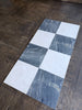 Sample of Sky Blue Azul Cielo 18X18 marble tile with checkered white and dark gray veining