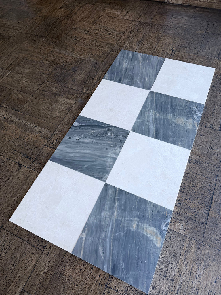 Sample of Sky Blue Azul Cielo 18X18 marble tile with checkered white and dark gray veining