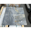 Four gray marble tiles from the Sky Blue Azul Cielo 18X36 Marble Tile collection