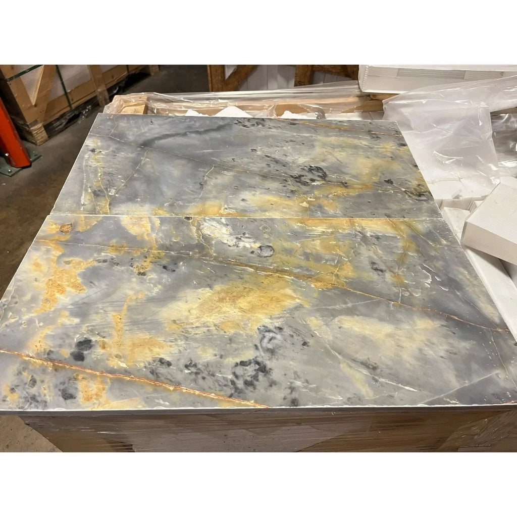 Gray and gold marble slabs in Sky Blue Azul Cielo 18X36 Marble Tile