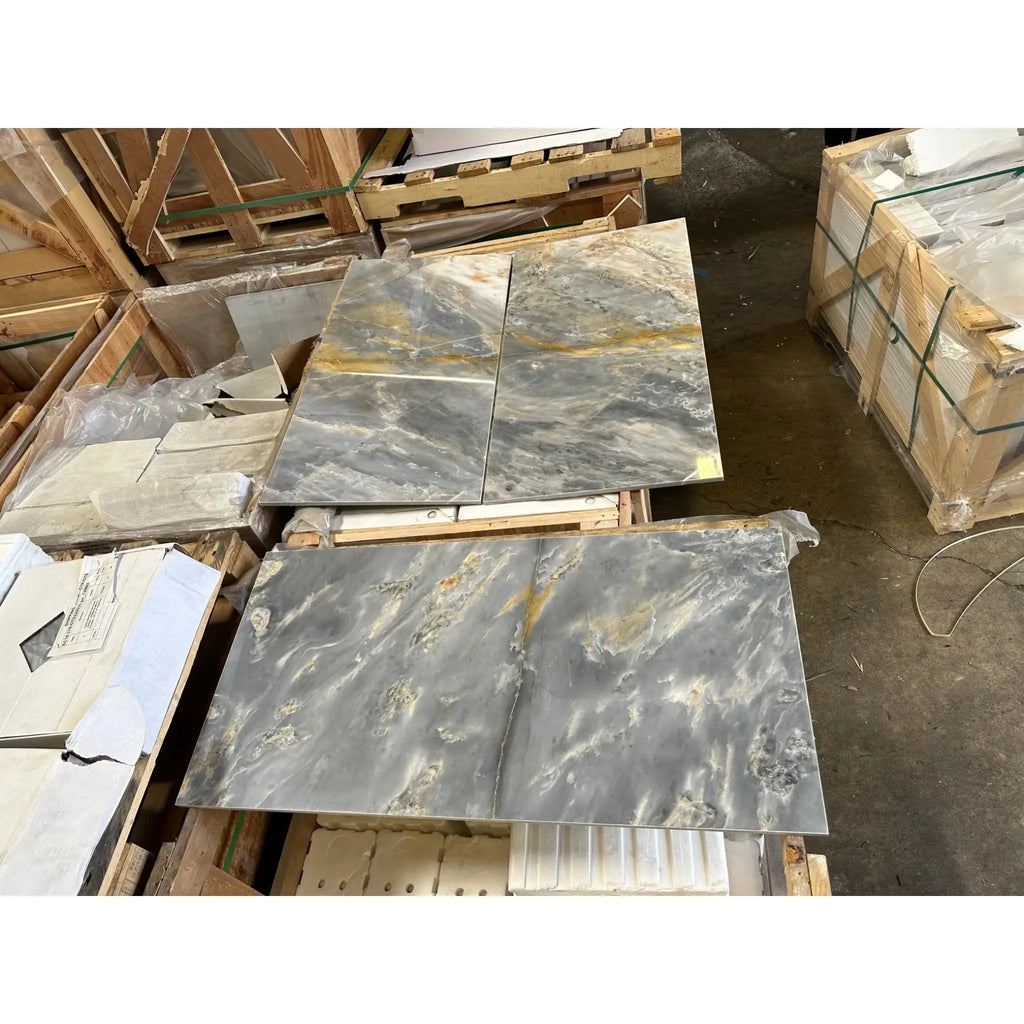 Grey and gold marble slabs in Sky Blue Azul Cielo 18X36 Marble Tile display