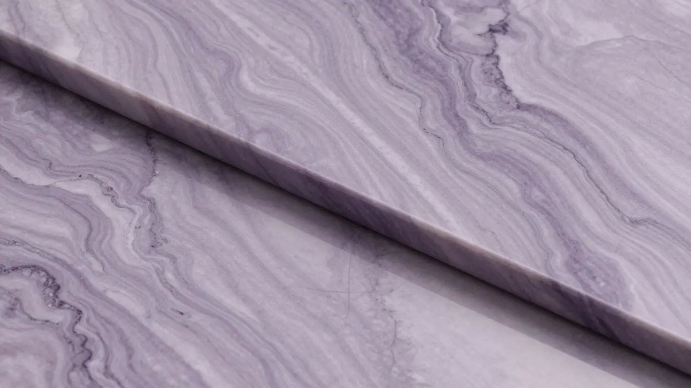 Polished lilac marble slabs with purple and grey veins.