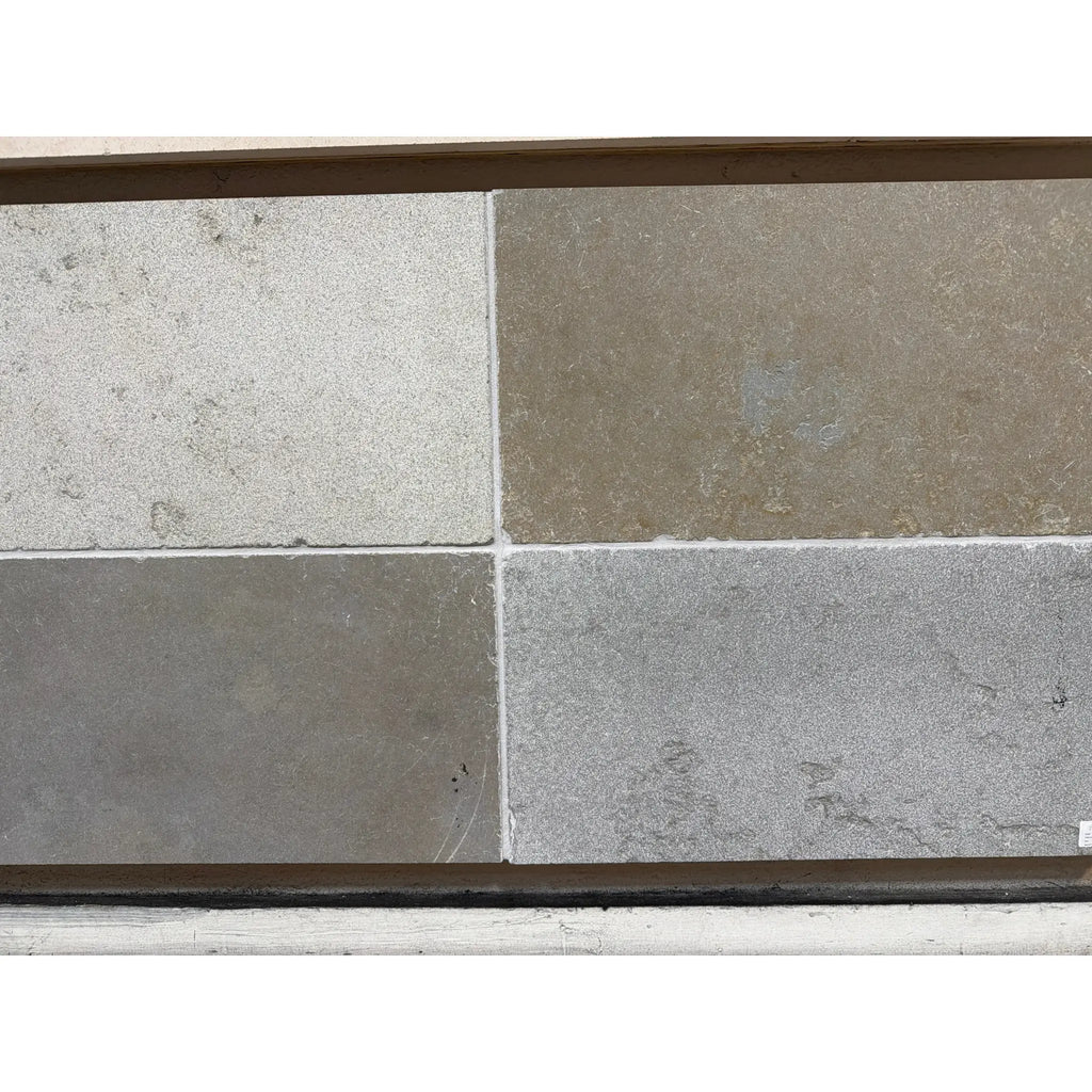 Solaris 16X24 reclaimed limestone tiles in multi finish blend, light and dark gray veined stone