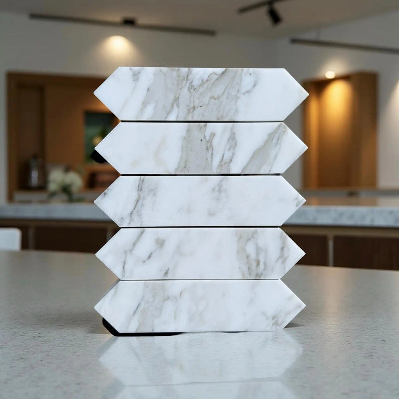 Stacked marble-patterned arrow tiles.