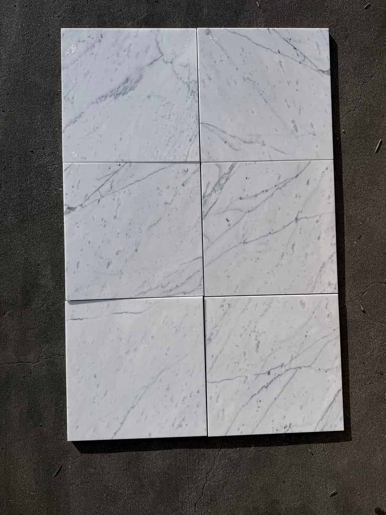 Six Statuario white marble 12x12 tiles with gray veining in grid