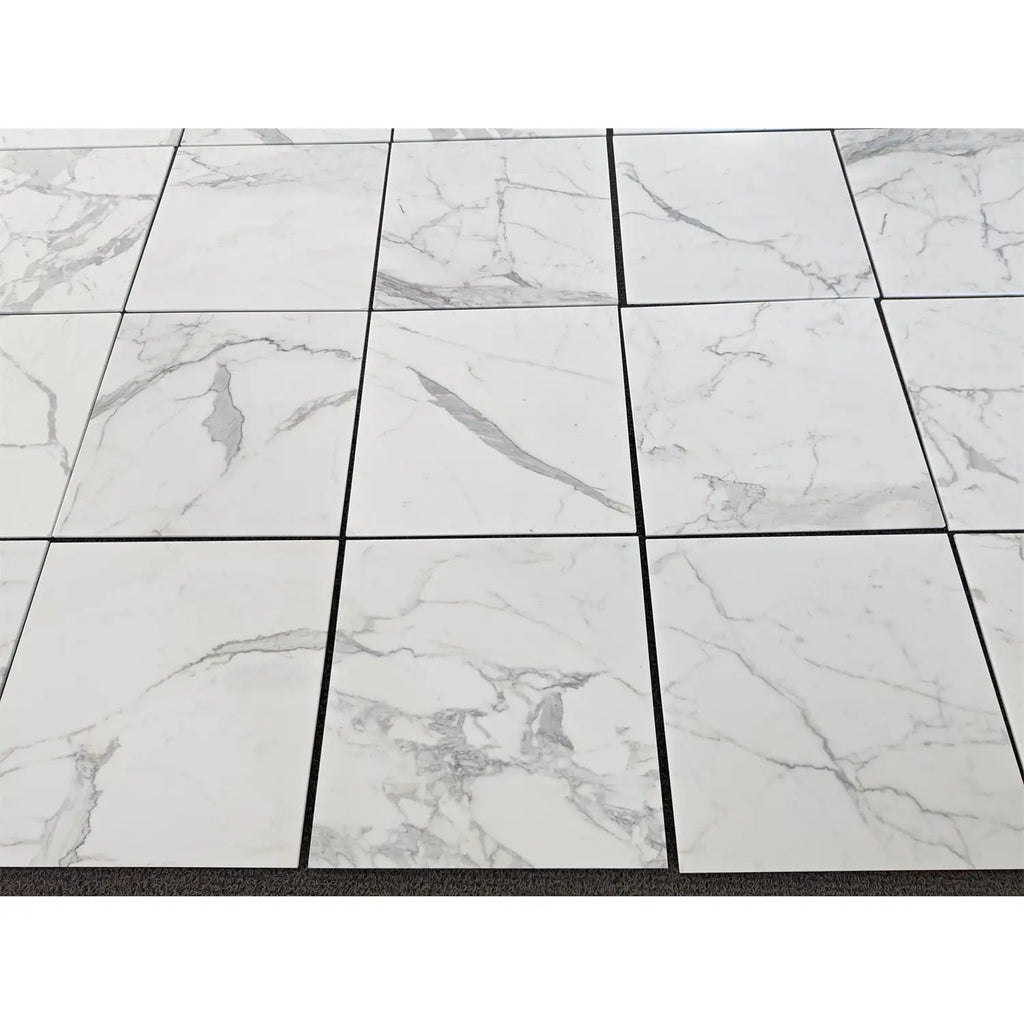 White marble-effect square tiles with subtle gray veining statuaria white 24x24 premium italian marble polished
