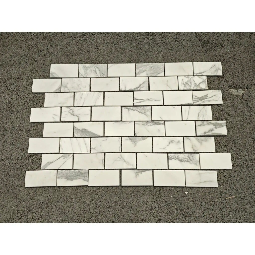 Statuario White 3x6 marble subway tiles in staggered pattern