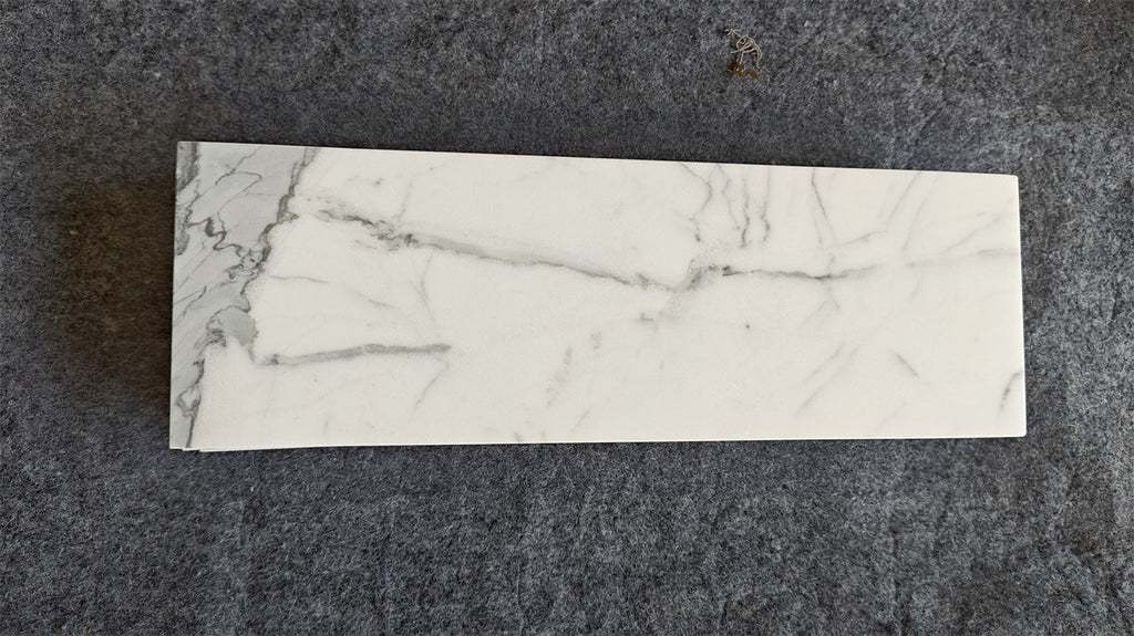 Statuario White 4x12 Italian marble tile with gray veining
