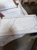 White marble-patterned tile with a white border from Statuary Statuario White 24X24 Italian Marble
